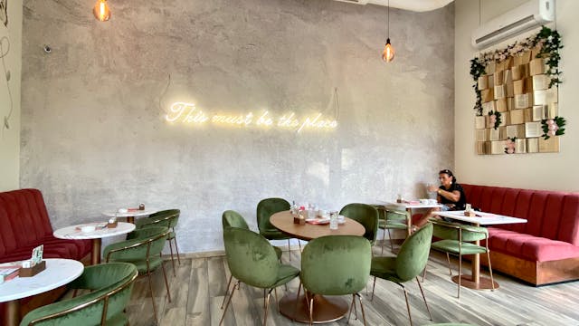 Stylish modern cafe in Belgrade featuring chic decor and dining setup. Ideal for eating out.
