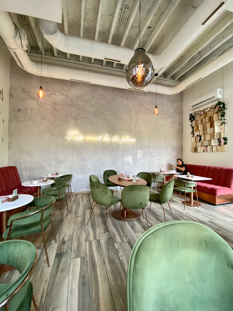 Stylish modern cafe in Belgrade featuring chic decor and dining setup. Ideal for eating out.